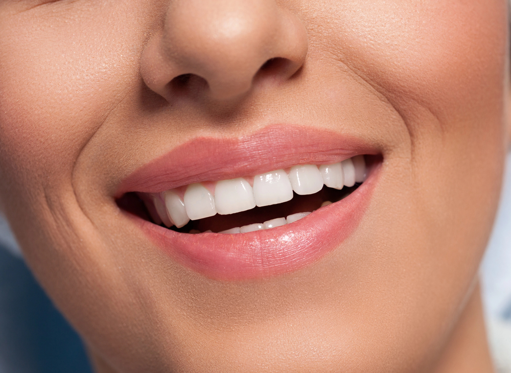 What causes gum recession and how can I stop it?