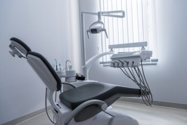 Empty dentist chair with a display of dental tools