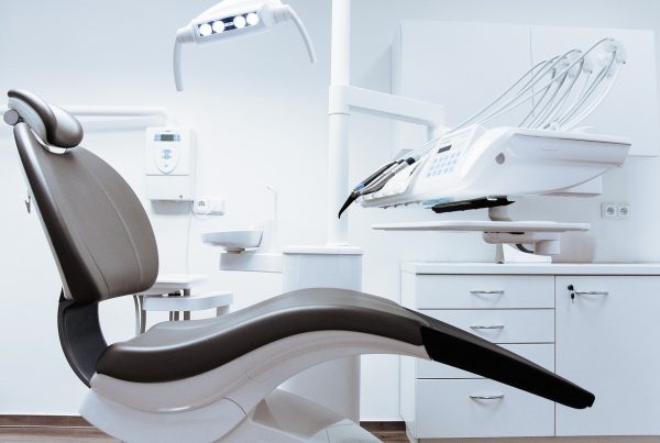 Empty dentist chair with a display of dental tools