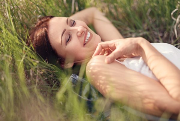 Top view of a young girl smiling up at the camera