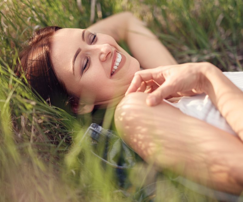 Top view of a young girl smiling up at the camera